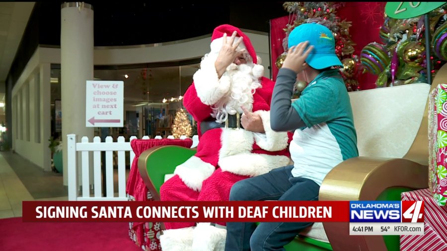 Santa signs with deaf/hoh children