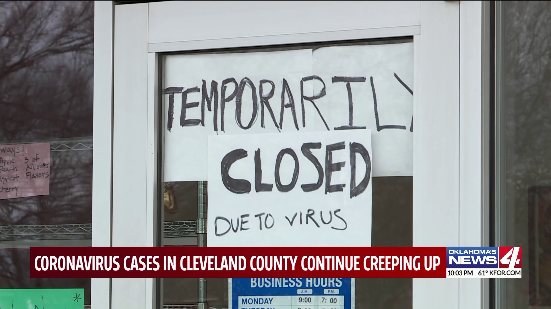 Sign on business that reads 'temporarily closed due to virus'