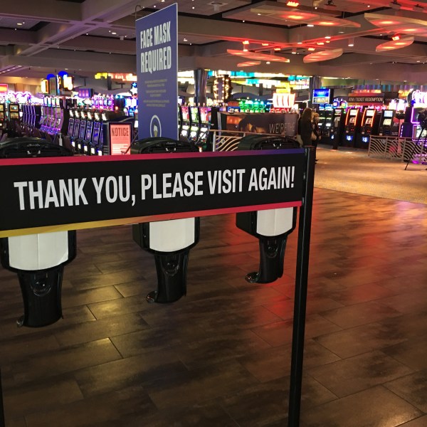 Sign at casino that reads 'thank you, please visit again'