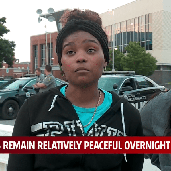 Picture of two young women protesting in OKC